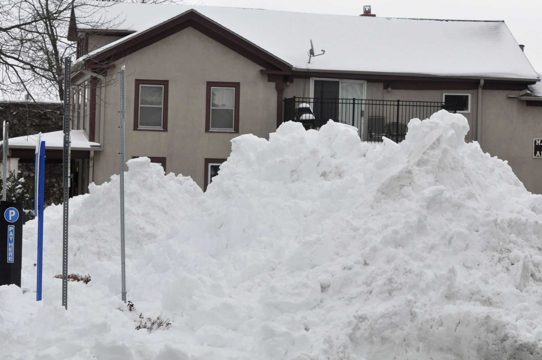 Large piles of snow can be seen near the front of City Parking Lot A, as city crews removed snow from the parking lot